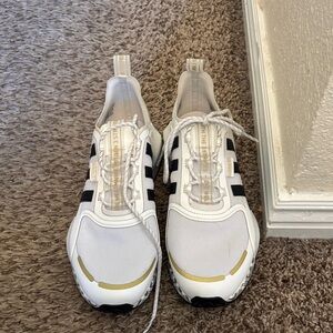 Adidas White Sneakers with Black Stripes and Gold Details